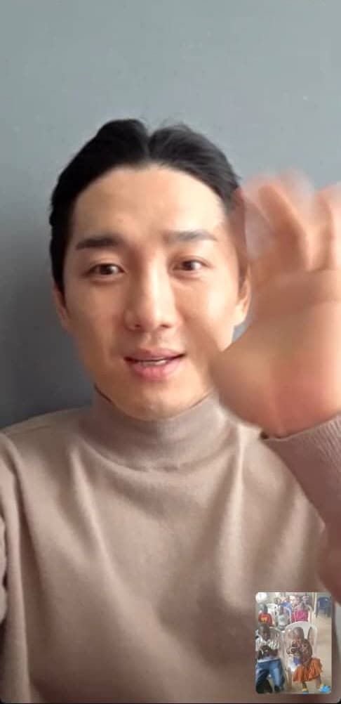 Mr Hwang Dae Seong waving during a video call