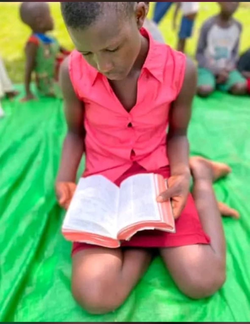 A girl reading her Bible