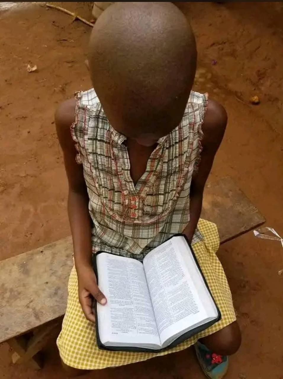 A child reading a Bible